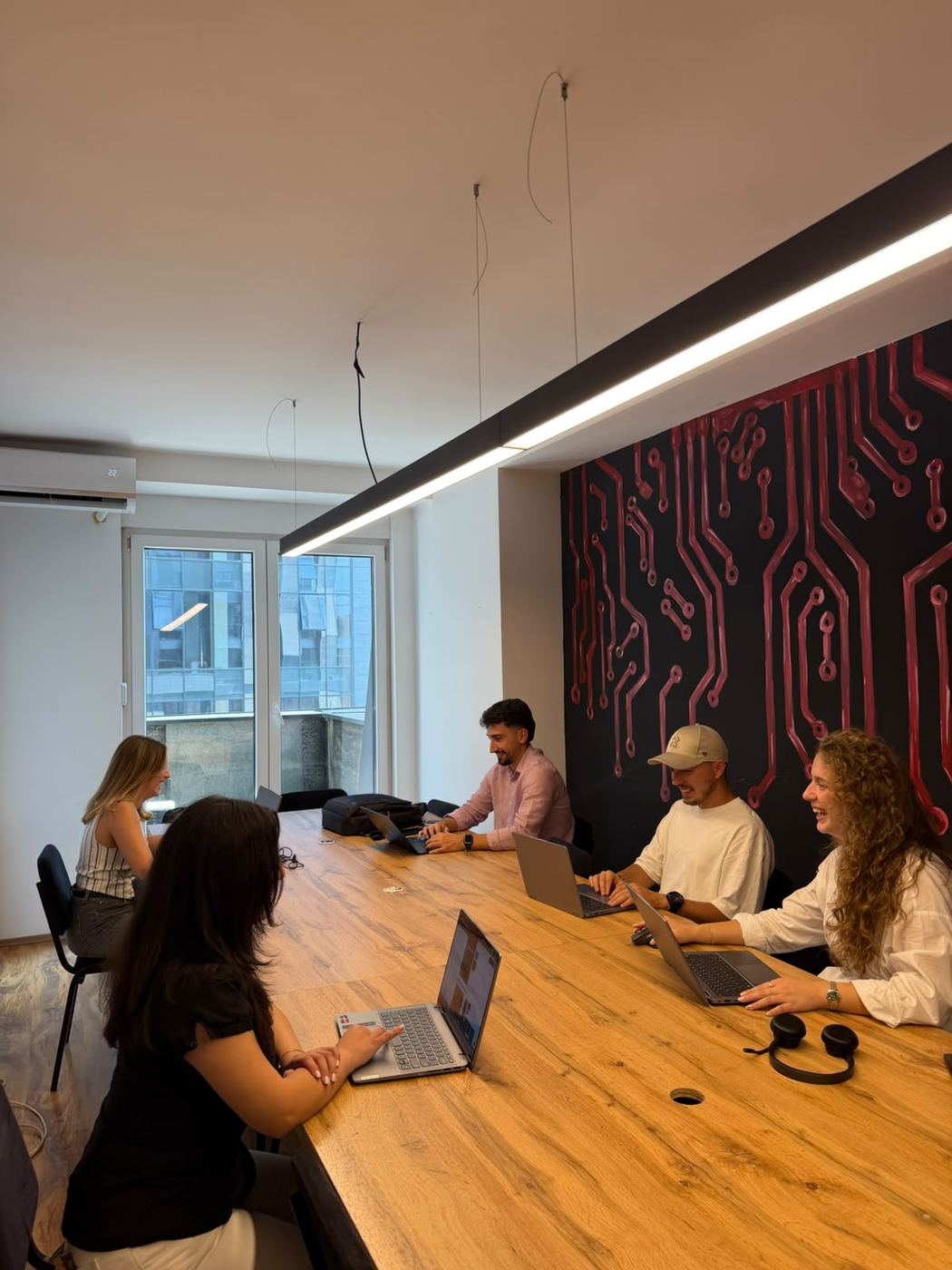 The team working together at a long table